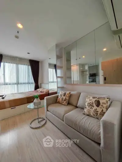 Modern studio apartment with cozy living area and stylish decor