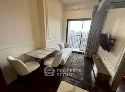 Stylish living room with city view, modern furniture, and elegant decor.