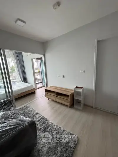 Modern apartment interior with cozy living room and bedroom view