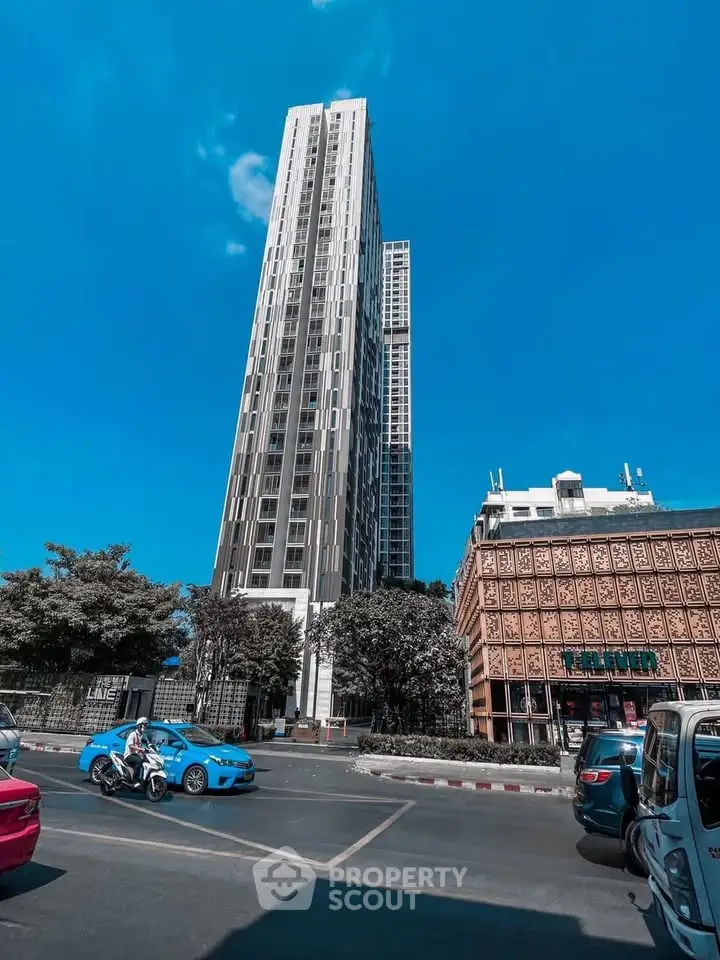 Stunning high-rise building with modern architecture and vibrant city surroundings.