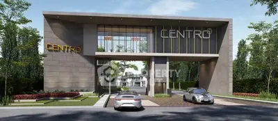 Modern architectural entrance of Centro residential complex with sleek design and luxury cars.