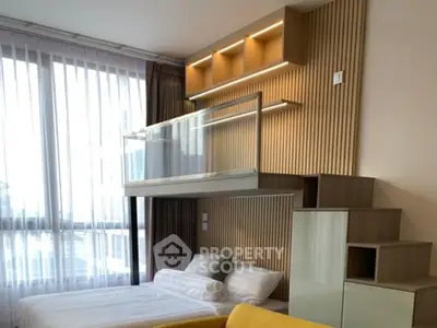 Modern bedroom with loft bed and stylish wooden accents, featuring large windows for natural light.