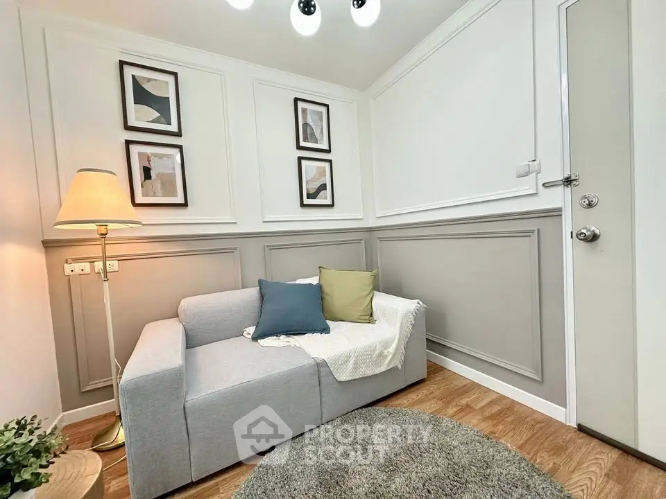 Charming living room with cozy sofa and elegant decor, perfect for relaxation and style.