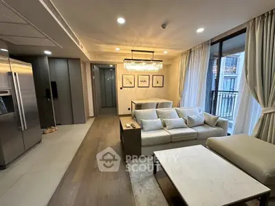 Luxurious modern living room with elegant decor and spacious layout, featuring a large sofa and stylish lighting.