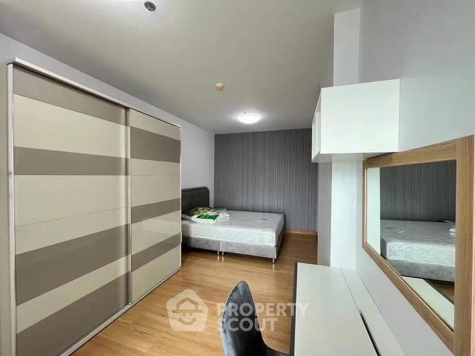 Modern bedroom with sleek wardrobe and stylish decor