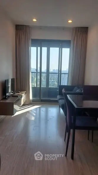 Modern living room with balcony view and sleek furniture