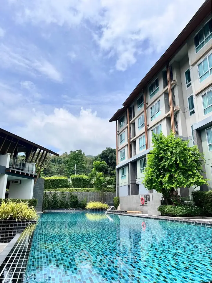 Modern apartment building with luxurious swimming pool and lush greenery