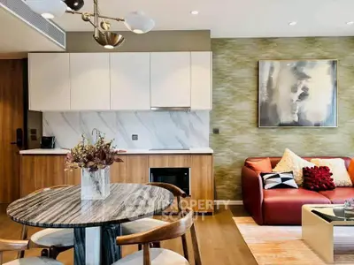 Modern living room with stylish kitchen and elegant decor in open layout apartment.