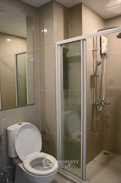 Modern bathroom with glass shower and sleek fixtures
