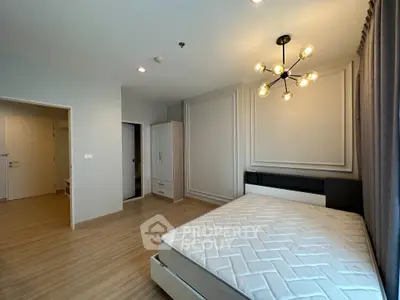 Spacious modern bedroom with elegant lighting and minimalist decor