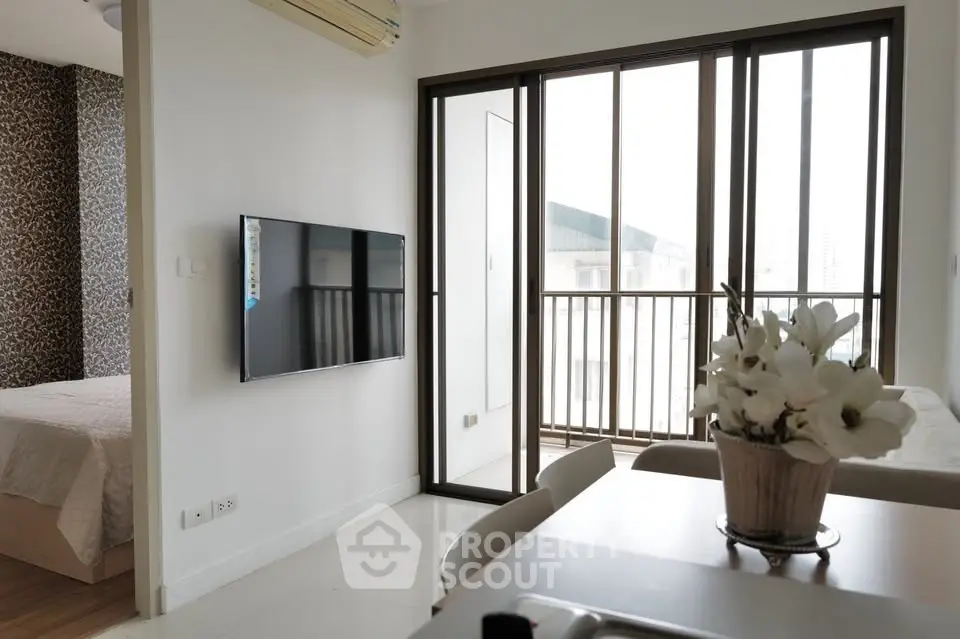 Modern apartment interior with open living space and balcony view