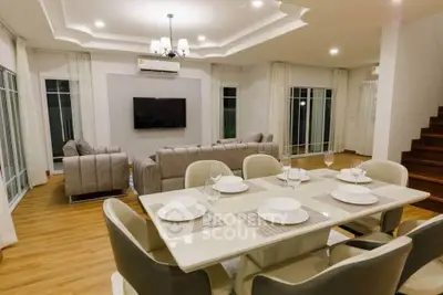 Spacious modern living room with elegant dining area and stylish decor