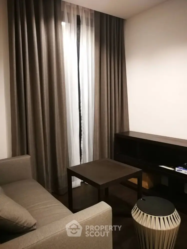 Cozy living room with modern furniture and elegant curtains