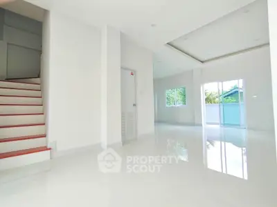 Spacious modern interior with glossy floors and natural light