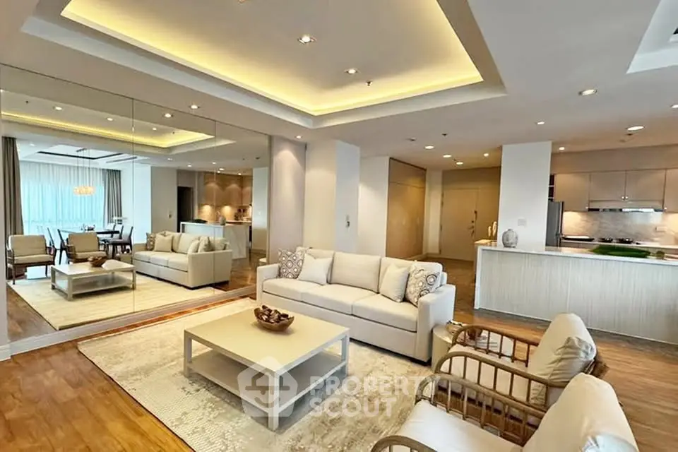 Luxurious open-plan living room with elegant decor and modern lighting