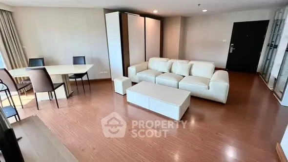 Spacious modern living room with elegant furniture and hardwood floors