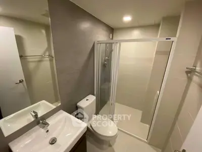 Modern bathroom with sleek design and glass shower enclosure