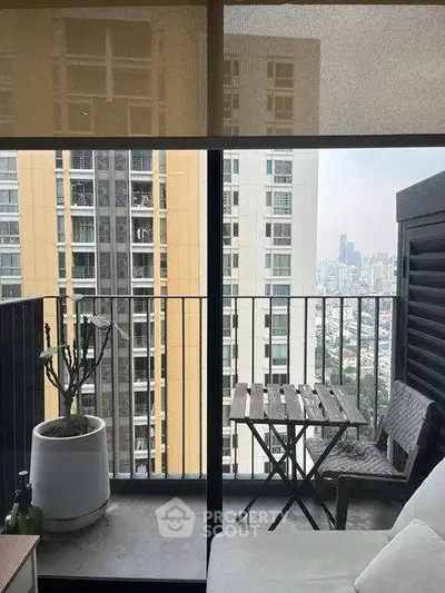 Charming balcony with city view, perfect for relaxation and enjoying urban skyline.