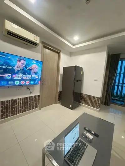 Modern living room with TV, air conditioner, and balcony view