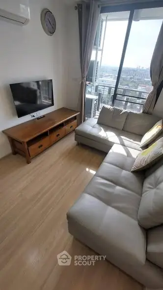 Cozy living room with modern sofa and city view