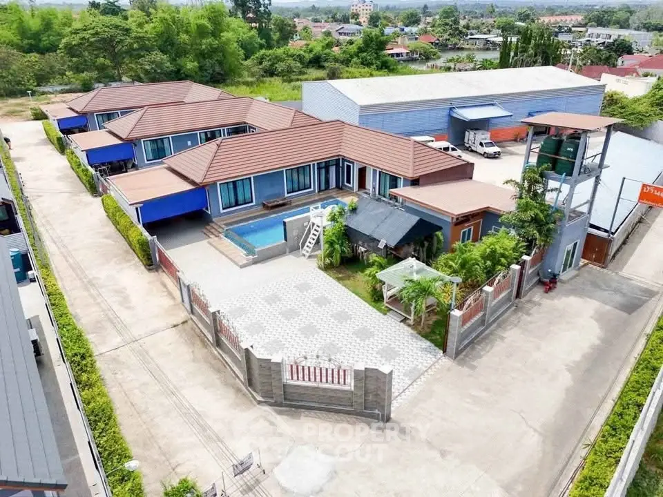 Spacious residential property with pool and modern design in a serene neighborhood.