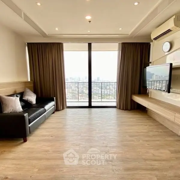 Spacious living room with city view and modern decor