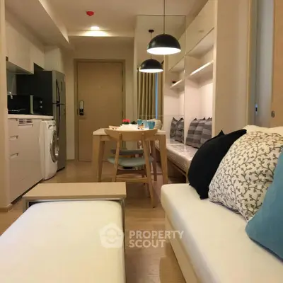 Modern apartment interior with cozy living area and dining space