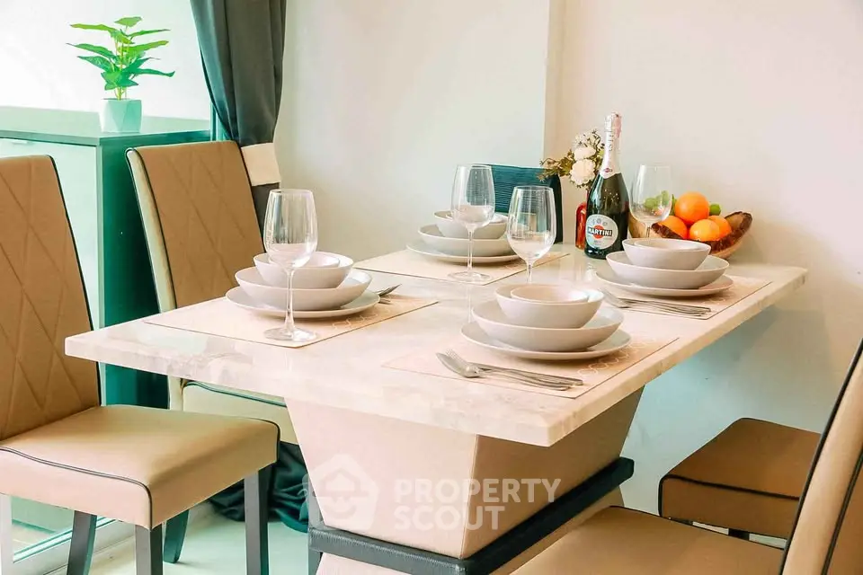 Elegant dining area with modern table setting and stylish chairs in a contemporary home.