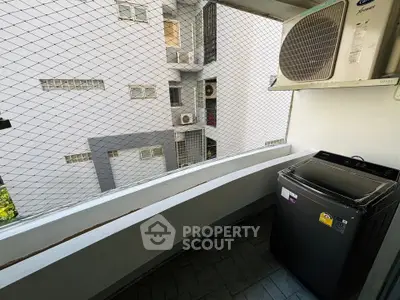 Compact balcony with washing machine and air conditioning unit