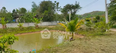 Scenic rural property with a serene pond and lush greenery, perfect for nature lovers seeking tranquility.
