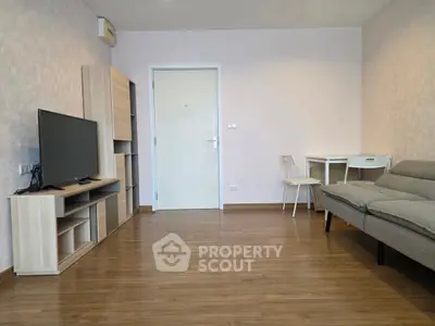 Modern living room with sleek furniture and wooden flooring