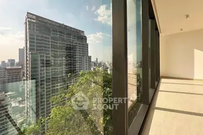 Spacious balcony with stunning city view in modern high-rise building