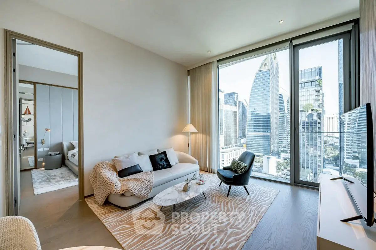 Modern living room with city view, stylish decor, and large windows in a high-rise apartment.