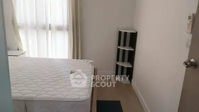 Cozy bedroom with natural light and minimalist decor