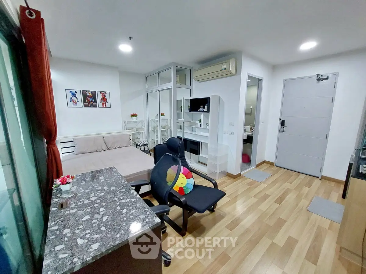 Modern studio apartment with open layout and stylish furnishings