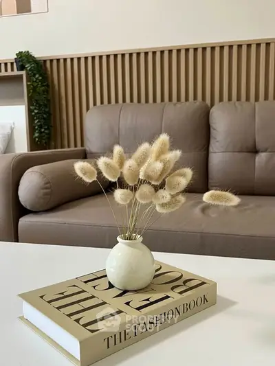 Stylish living room with modern decor and cozy sofa, perfect for relaxation.