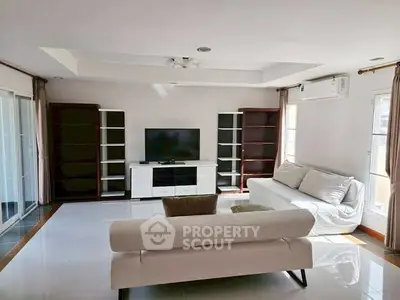 Spacious living room with modern furniture and natural light