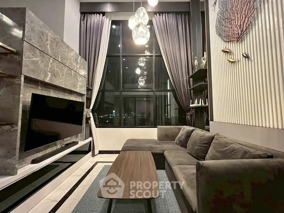 Luxurious modern living room with high ceilings and stunning city view.