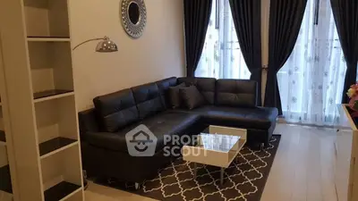Stylish living room with black leather sectional sofa and elegant decor