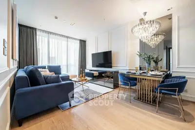 Luxurious modern living room with elegant blue sofas and chic dining area