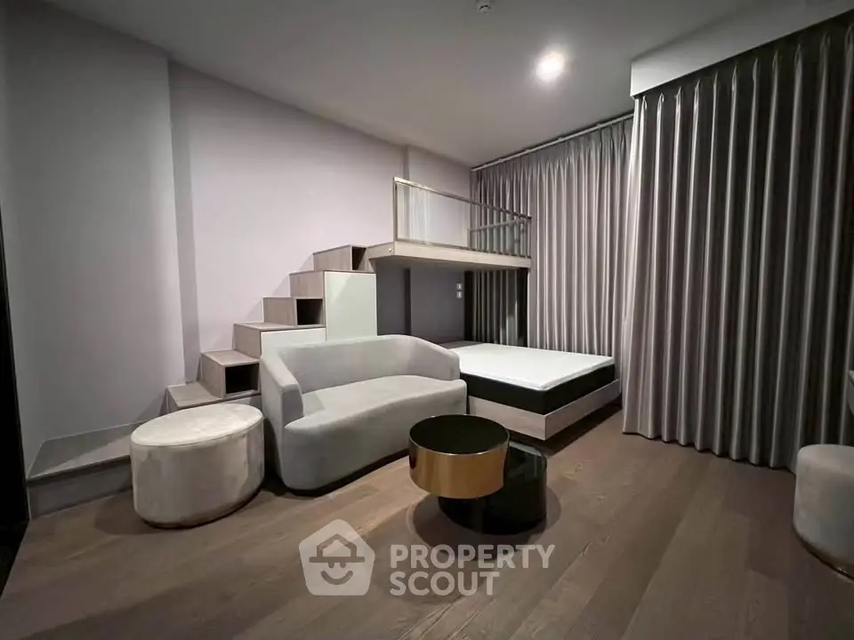 Modern living room with loft bed and stylish furniture in a contemporary apartment.