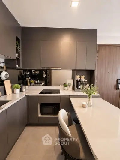 Modern kitchen with sleek cabinetry and integrated appliances