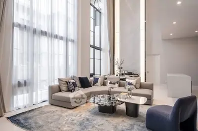 Luxurious modern living room with high ceilings and elegant decor