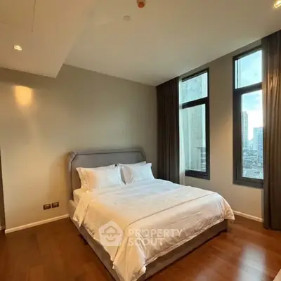 Luxurious bedroom with city view and elegant decor in modern apartment