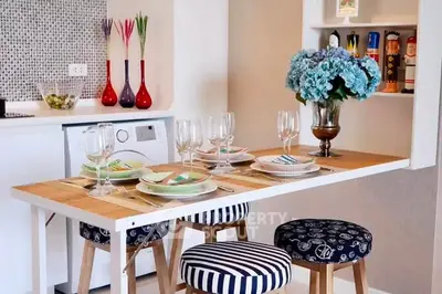 Chic kitchen with stylish dining setup and modern appliances