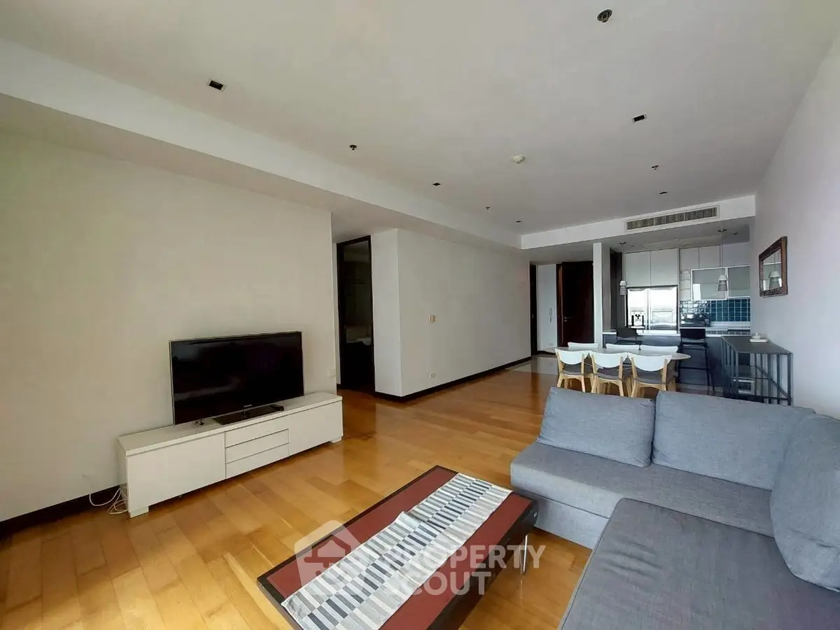 Spacious modern living room with hardwood floors and stylish furniture