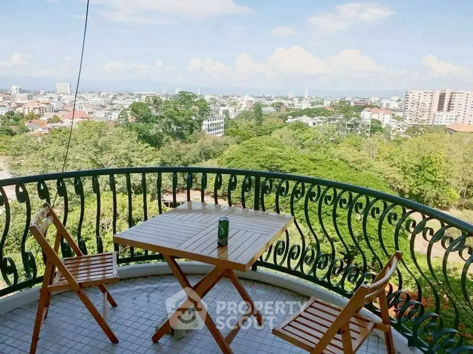 Charming balcony with stunning cityscape view, perfect for relaxation and enjoying the outdoors.