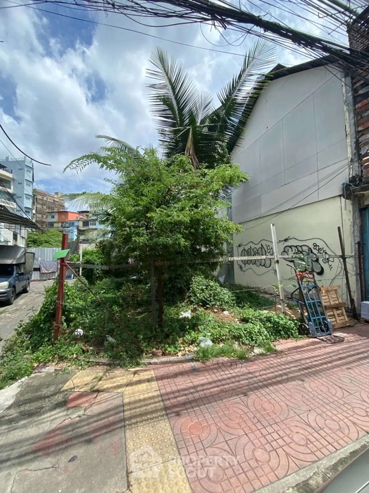 Vacant urban lot with potential for development in bustling city area.
