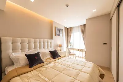 Luxurious bedroom with elegant decor and natural light