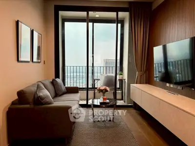 Modern living room with large windows and balcony view, featuring stylish furniture and decor.